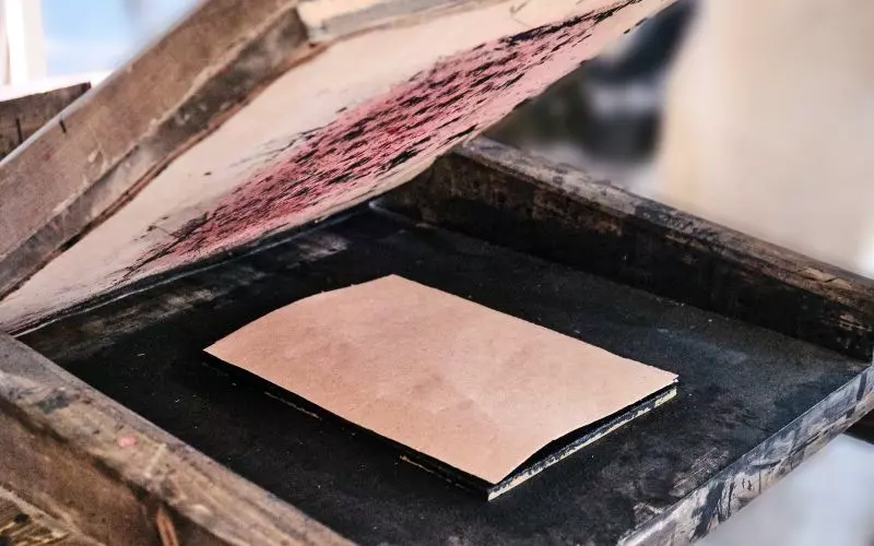 A letterpress printing plate on a wooden block