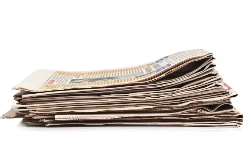 A stack of folded newspapers