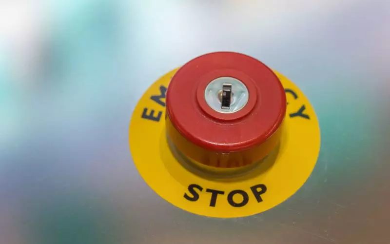 A red emergency stop button