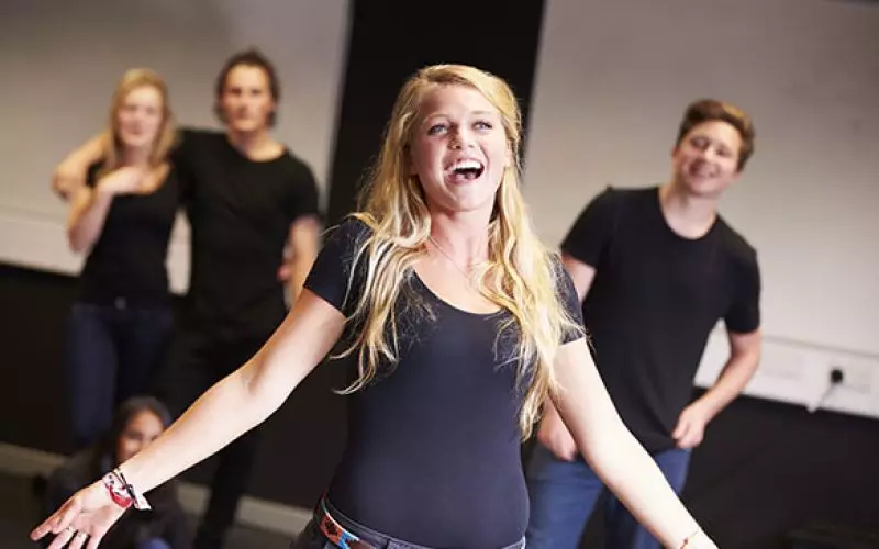 Performers rehearsing in a studio