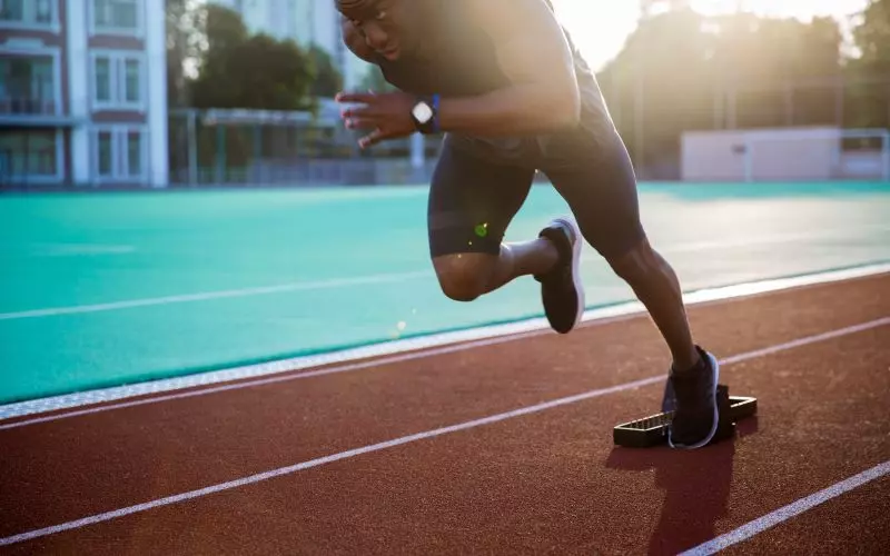 A sprinter accelerating out of the starting blocks