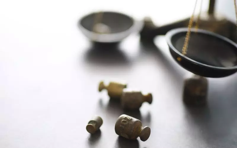 A balance scale with brass weights