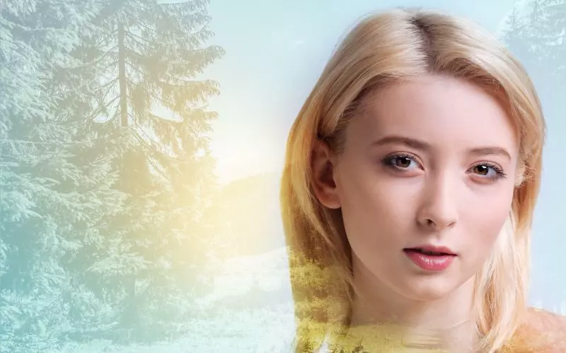 A portrait overlaid with a landscape double exposure