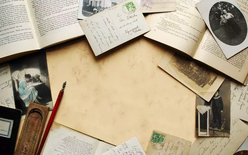 Vintage newspapers and letters spread out