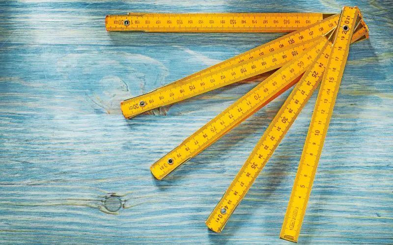 A yellow folding ruler fanned out