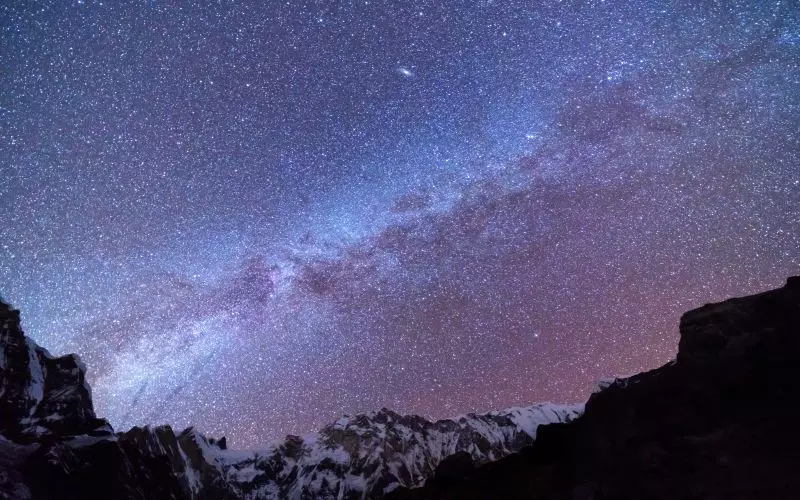 The Milky Way over a canyon at night