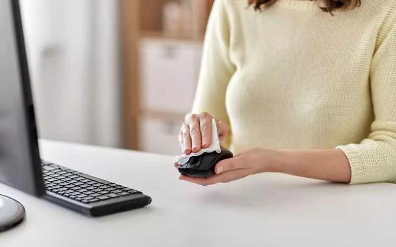 Someone working at a clean desk with a monitor
