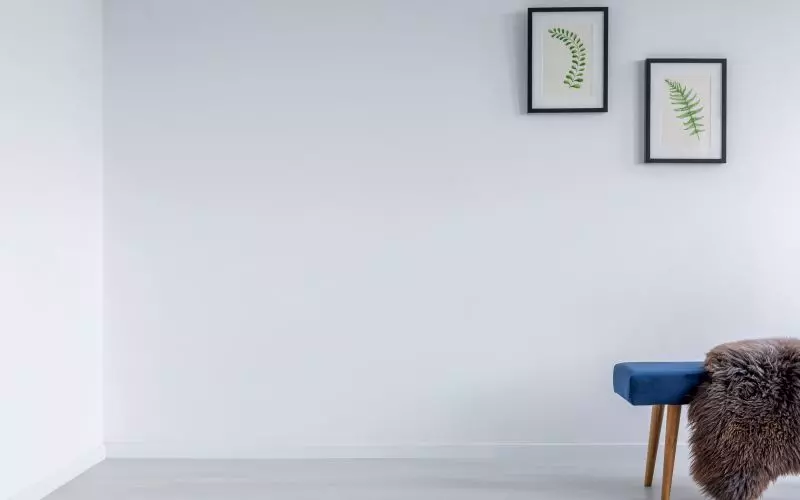Framed prints on a plain wall