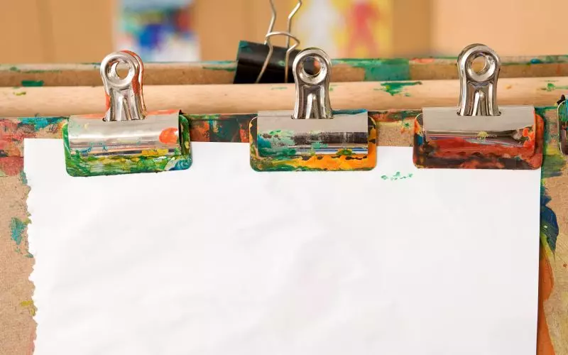 Printed sheets clipped to a board