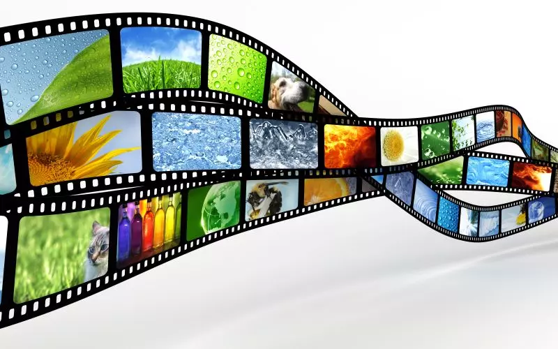 A curving film strip with images in its frames