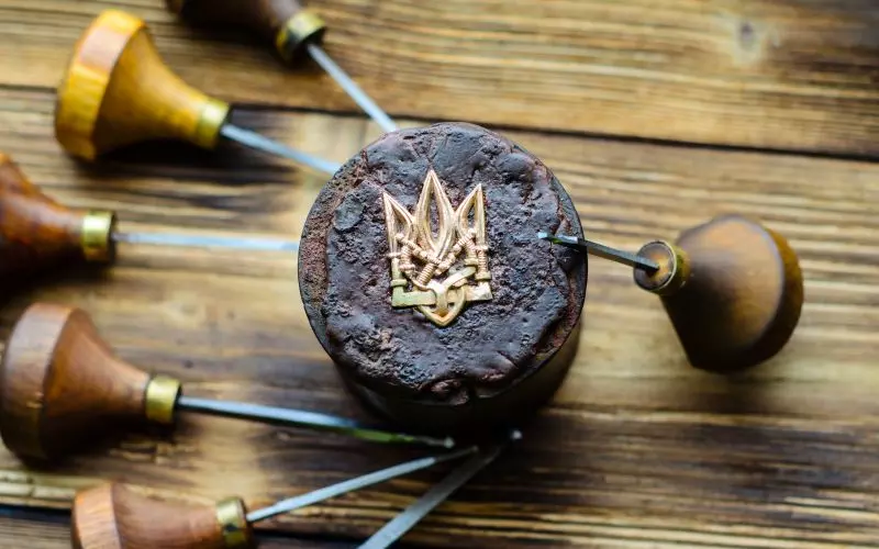 Brass seal stamps on a wooden desk