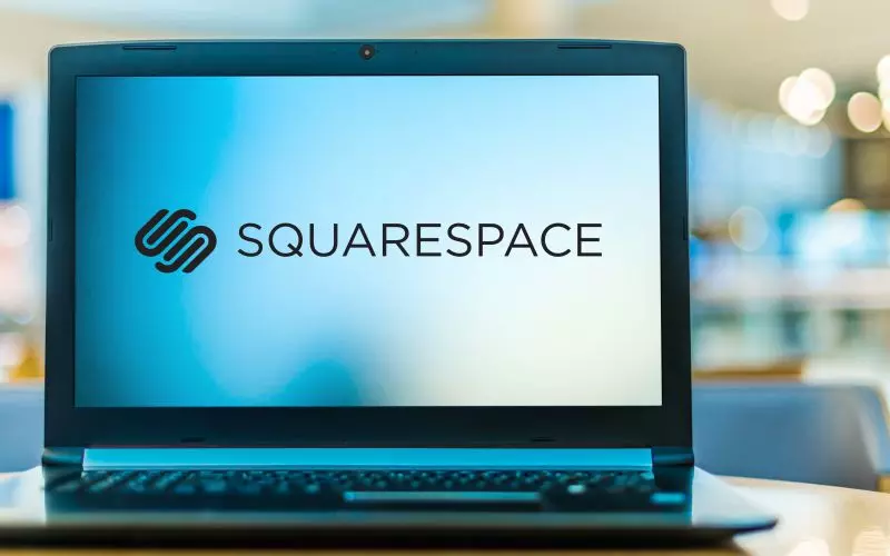 A laptop showing the Squarespace logo