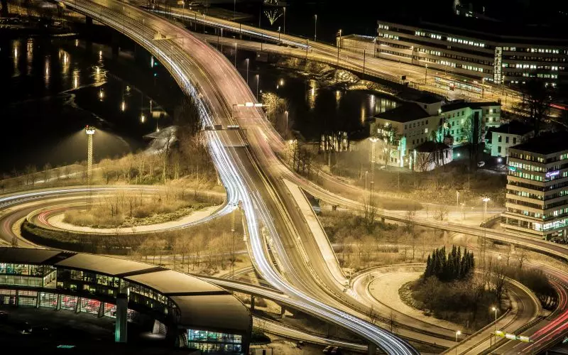Light trails on a highway interchange from above