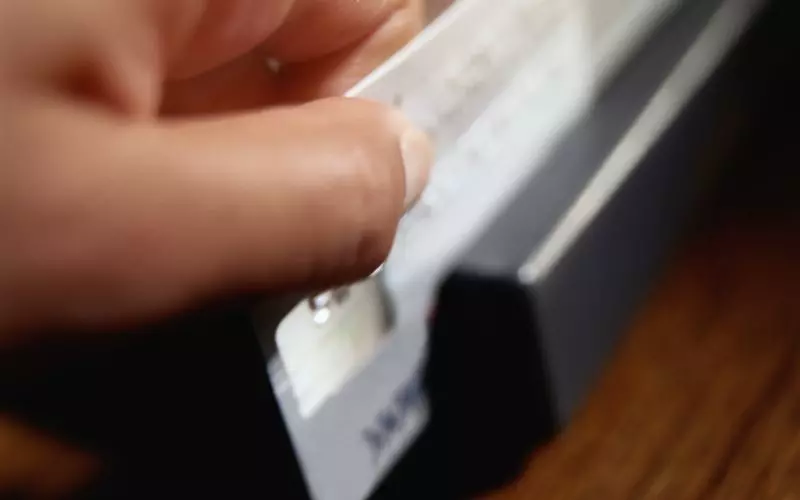 A close view of a finger on a laptop trackpad